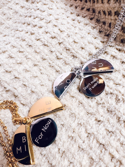 Necklace with pendant on a textured surface