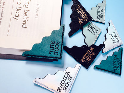 Book-themed bookmarks with text on a light blue background